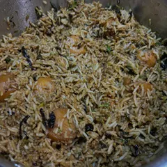 A pot of freshly cooked Aloo Dum Biryani, with fragrant long-grain rice and tender potatoes. All the biryani masalas are prepared by me from scratch.
