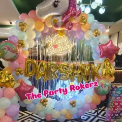 A dreamy Unicorn-themed 4th birthday party. I used a pastel rainbow balloon arch, a large unicorn foil balloon, a shimmer backdrop, and a neon sign to create this enchanting look.