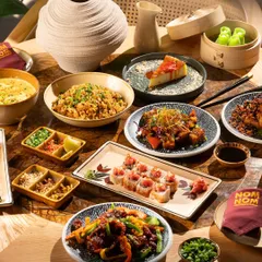 A full-table spread showcasing the variety of a Pan-Asian menu. My goal here is to create a sense of abundance and a feast for the eyes, inviting customers to try everything.