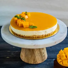 Our Mango Cheesecake is the perfect blend of creamy and fruity. A classic baked cheesecake base is topped with a smooth, vibrant mango puree glaze and fresh fruit.