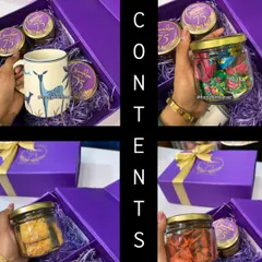 The contents of our personalized 75th birthday hamper. This shows the premium printed mug and the three jars of almond cookies, ragi chips, and assorted truffle chocolates.
