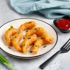 Our simply prepared Fried Prawns. These prawns are lightly battered and fried until golden, served with a side of ketchup for dipping.