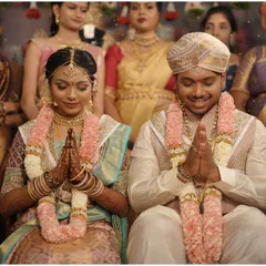 The couple in a moment of prayer during their Muhurtham ceremony, a beautiful symbol of their union.