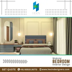 A contemporary bedroom design featuring a mix of textures. We used light wood laminates, a cushioned headboard, and wall molding to create a layered look. The integrated dressing table with a large mirror adds functionality to the space.