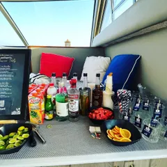 We bring the full bar experience to any location, including a private yacht. This compact yet complete setup for a bachelorette party included a full range of spirits, fresh fruit garnishes, and a custom menu.