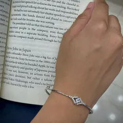 An elegant and simple ladies' bracelet in a silver finish with a small AD stone motif. This is a perfect accessory for daily wear or for the office.