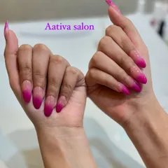Go bold with a vibrant pink ombré. These long stiletto nails feature a dramatic fade from a sheer base to a bright, hot pink tip.