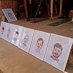 Getting ready for a big event with a lineup of framed caricatures. Whether for a corporate event, wedding, or party, I can create on-the-spot art that serves as both entertainment and a personalized return gift for your guests.