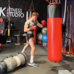 A client practicing his punches on the heavy bag. This is a fantastic way to build power, improve cardiovascular endurance, and release the stress of the day in a productive way.