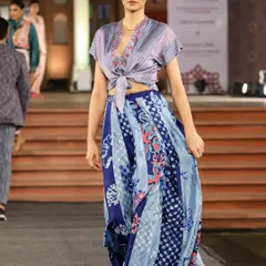 Our textiles come alive on the runway. This ensemble, created in collaboration with Studio Swiatlo, features a blend of pattern dyeing and discharge printing on handloom fabric, showcasing the versatility of our craft for contemporary fashion.