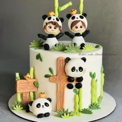 This adorable panda party cake is all about cute details. Learn to model charming fondant pandas, bamboo stalks, and even tiny human figures in panda costumes to create a playful and heartwarming scene.