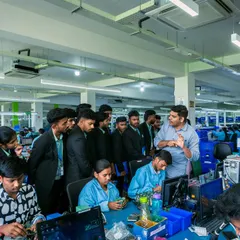 A group of management students keenly listens during an industrial visit to our facility. These sessions provide a practical link between their academic studies and real-world operations, technology, and work culture.