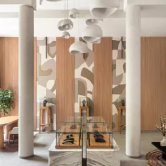 Inspired by the facets of a diamond, this abstract mural was created for a jewelry boutique. The design uses layered, earthy tones and clean forms to create a sense of rhythm and elegance, complementing the store's sophisticated interior.