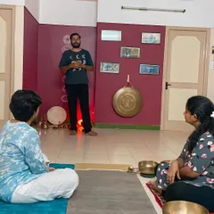 Here, I am explaining the principles of Nada Yoga to a small group of students. My courses are designed to be interactive, allowing for deep discussion and a personal understanding of the philosophy behind sound and its impact on our energy systems.
