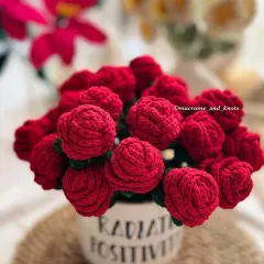 For a classic romantic gesture, I created this dense arrangement of deep red crochet roses. Placed in a mug that says 'Radiate Positivity', it's a gift that offers both beauty and a lovely message.