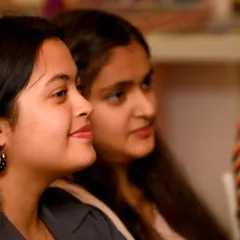 A candid shot of two audience members enjoying a performance. I love capturing these moments of shared experience, which are just as important as what's happening on stage.