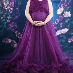 A lovely vine-colored maternity gown with bottom ruffles and detachable sleeves and tail. This versatile piece allows for multiple looks during your photoshoot.