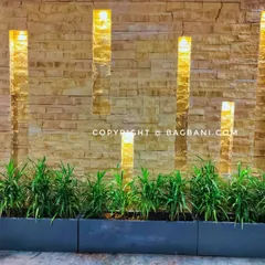 A wider shot of the indoor planter setup, showing three troughs arranged together for a continuous line of greenery.