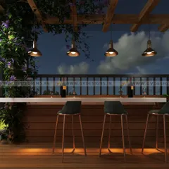 An outdoor bar designed for entertaining. We used a durable countertop and wood-paneled base, complemented by elegant high-top chairs. The space is framed by a wooden pergola with climbing plants and illuminated by stylish pendant lights for the perfect evening setting.