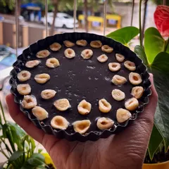 My Nutella tart held up close. It's the perfect size for a return favor or a sweet gift for someone special. The combination of chocolate and hazelnut is simply delightful.