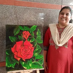Dr. Aqila proudly stands with her realistic oil painting of a red rose. In this piece, she mastered the art of slow blending and layering, which is unique to oil paints, to create the soft, velvety texture of the petals.