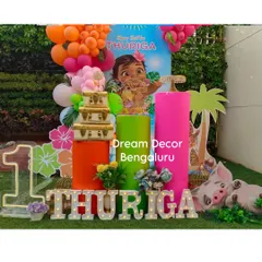 We brought the tropical vibes of Motunui to Bangalore for this Moana-themed first birthday. The decor features vibrant balloon colors, character cutouts of Moana and Pua, and tropical leaf details for an island adventure.