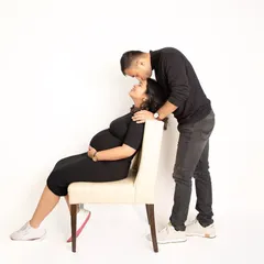 A simple, classic portrait of a couple in love. Against a clean white background, the focus is entirely on their connection and the tender moment they share.