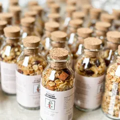 These granola bottles are a perfect healthy, vegan, and delicious favor for any occasion. We offer flavors like Almond Cranberry and Hazelnut Chocolate.