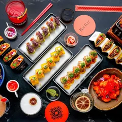 This large, dark, and moody flatlay for a high-end restaurant showcases an entire spread of sushi and cocktails. This type of shot is perfect for menu covers or promotional banners, demonstrating my ability to style complex, multi-item scenes that feel luxurious and appealing.