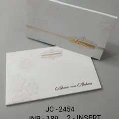 This minimalist white boxed invitation features a simple gold band and subtle embossed floral details. It's a perfect example of understated elegance for a modern wedding.