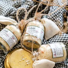 My mineral-rich bath salts, packaged in charming glass bottles with a small muslin bag for use. This blend of three salts helps detoxify the body and soothe sore muscles.