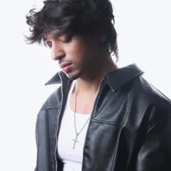 A candid, thoughtful pose from my 2025 press kit shoot. It shows a different, more introspective side to my personality.