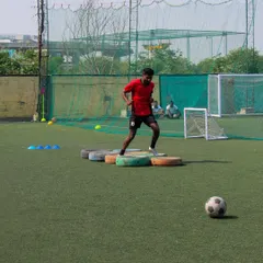 A participant steps through tires in our agility challenge. All fees from this challenge go directly to our foundation partner, Needbase India.