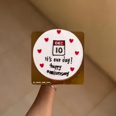 A personalized anniversary cake featuring a calendar marking the special date, "Dec 10."