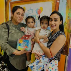The birthday girls with their gifts and friends. We believe in celebrating these milestones together, creating a warm and supportive environment for everyone.