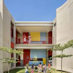 A perfect example of our climate-responsive school architecture. The building's form creates this sheltered 'aangan' or courtyard, offering a cool, shaded space for children to play, even when the Punjab sun is strong.