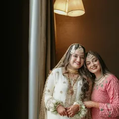 A sweet moment between sisters. We look for these quiet, candid interactions that showcase the special bonds between family members.