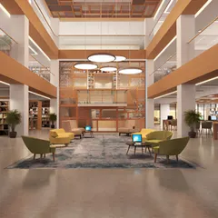 This render for the Amity University library in Mumbai shows a grand, multi-story space. We designed it with a mix of lounge seating and formal study areas to serve as a central hub for the campus community.