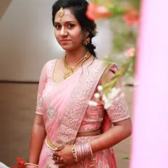 For this engagement, we chose a beautiful pink lehenga saree. The makeup look is soft and pretty, with a matching pink lip, defined eyes, and a traditional maang tikka.