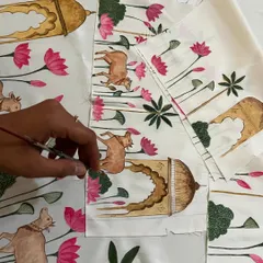 Here I am painting a Rajasthani-themed design onto fabric for a matching father and son kurta set. The artwork features traditional architectural elements, pichwai cows, and lotus flowers.