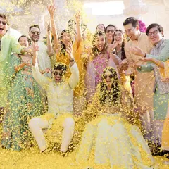 The pure, unadulterated joy of a Haldi ceremony. This is the kind of happy chaos I live for, where friends and family come together to shower the couple in love, laughter, and a whole lot of flower petals.