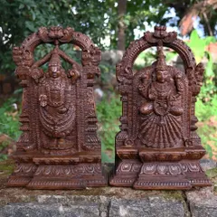 A pair of 19-inch sculptures depicting Lord Balaji and his consort, Goddess Padmavathi. These idols are perfect as a set for a home altar, carved with intricate detail in a rich wax brown finish.