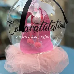 A unique way to say congratulations on the new arrival. This gift features a cute pink baby bag presented inside my signature balloon packaging, making for a truly memorable and exciting reveal.