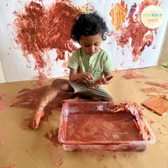 This image captures the essence of our Messy Artist sessions. It’s not about a perfect painting, but about the rich, tactile experience of feeling the paint and seeing the colors mix. This is where a child's confidence in their own abilities begins.