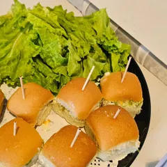 Say hello to our new Pav Bites! These mini bread rolls filled with a savory mixture are a quick and delightful appetizer, perfect for passing around at any gathering.