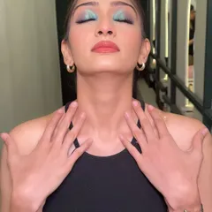 Playing with color. This look features a stunning pop of aqua blue on the lids, blended into a soft wing. It's a great way to add a fun, modern twist to your makeup.