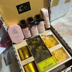 A luxurious bride-to-be hamper featuring Kimirika's "Love Story" bath and body care set, along with a fragrance collection of votive candles and floating candles.