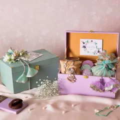 Our Jade Joy Hamper comes in these beautiful pastel-colored trunks with tassel details, making the unboxing a delightful experience.