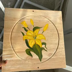 This panel showcases a vibrant yellow lily. Each board in the series features a different flower, creating a diverse botanical gallery on the ceiling.