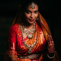 A key part of our signature style is using dramatic lighting to create timeless bridal portraits. Here, we focused on highlighting the bride's graceful expression and the stunning detail of her traditional wedding jewelry and attire.